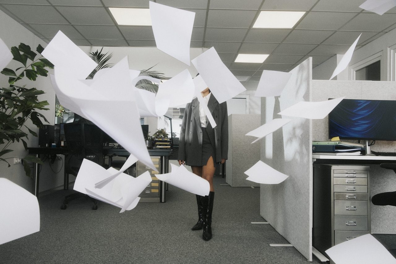 Papers flying in office — After Hours