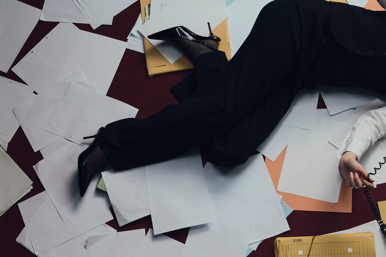Midnight Agenda — scattered papers and heels